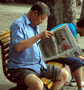 Image of man reading newspaper