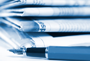 Newspaper and pen