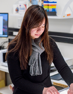 Woman preparing sunglasses in a testing unit