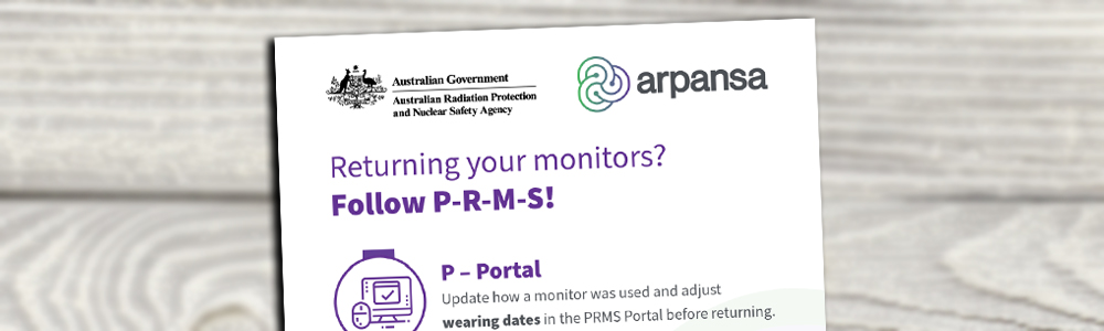 PRMS poster zzomed in and cropped on a blurred wooden background