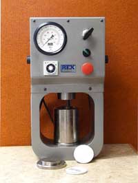 Press used to compress the filter before analysis