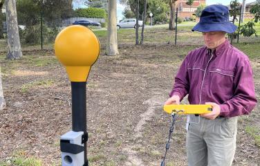 A scientist is measuring radio waves using a spectrum analyser