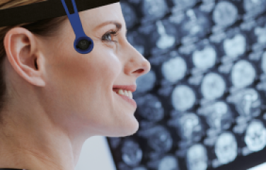 Woman wearing headband with radiation eye monitor attached