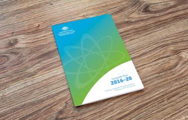 Corporate Plan document on a wooden table.
