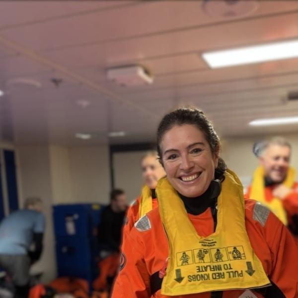 A woman is wearing a special outfit to keep her warm in Antarcica
