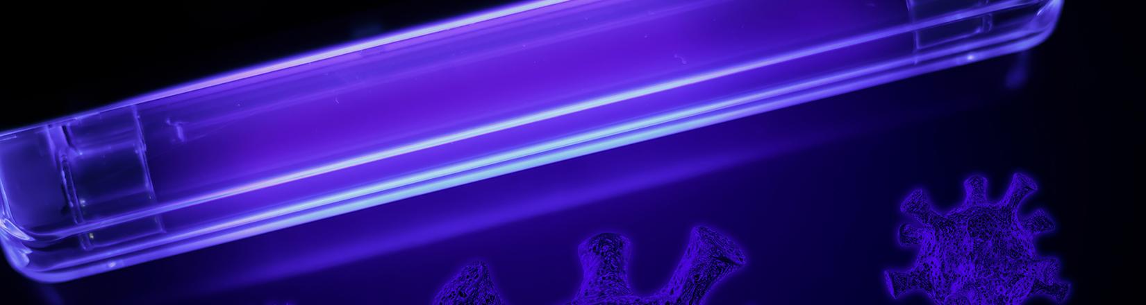 Cropped shot of a UV lamp in the dark with bacteria-like spores next to it